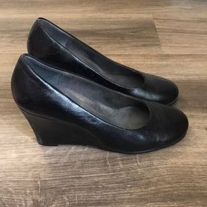 Comfy, black wedge heel.